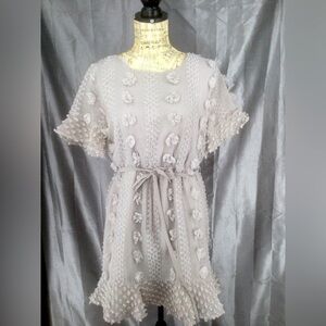 Grey med. summer dress by &merci with textured pom pom detailing, elastic waist.